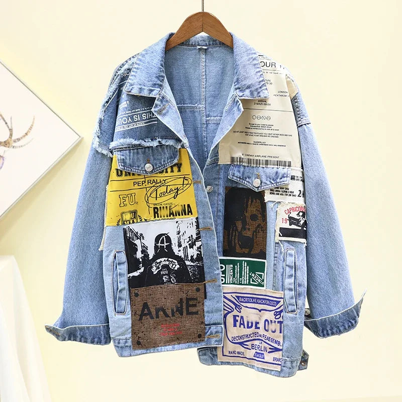 A stylish vintage denim jacket with colorful graphic patches, perfect for a bold and unique fashion statement.