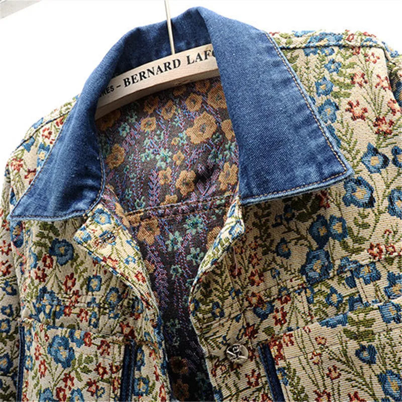 Close-up of a women's denim jacket featuring vintage jacquard embroidery, big pockets, and a loose fit for a chic retro look.